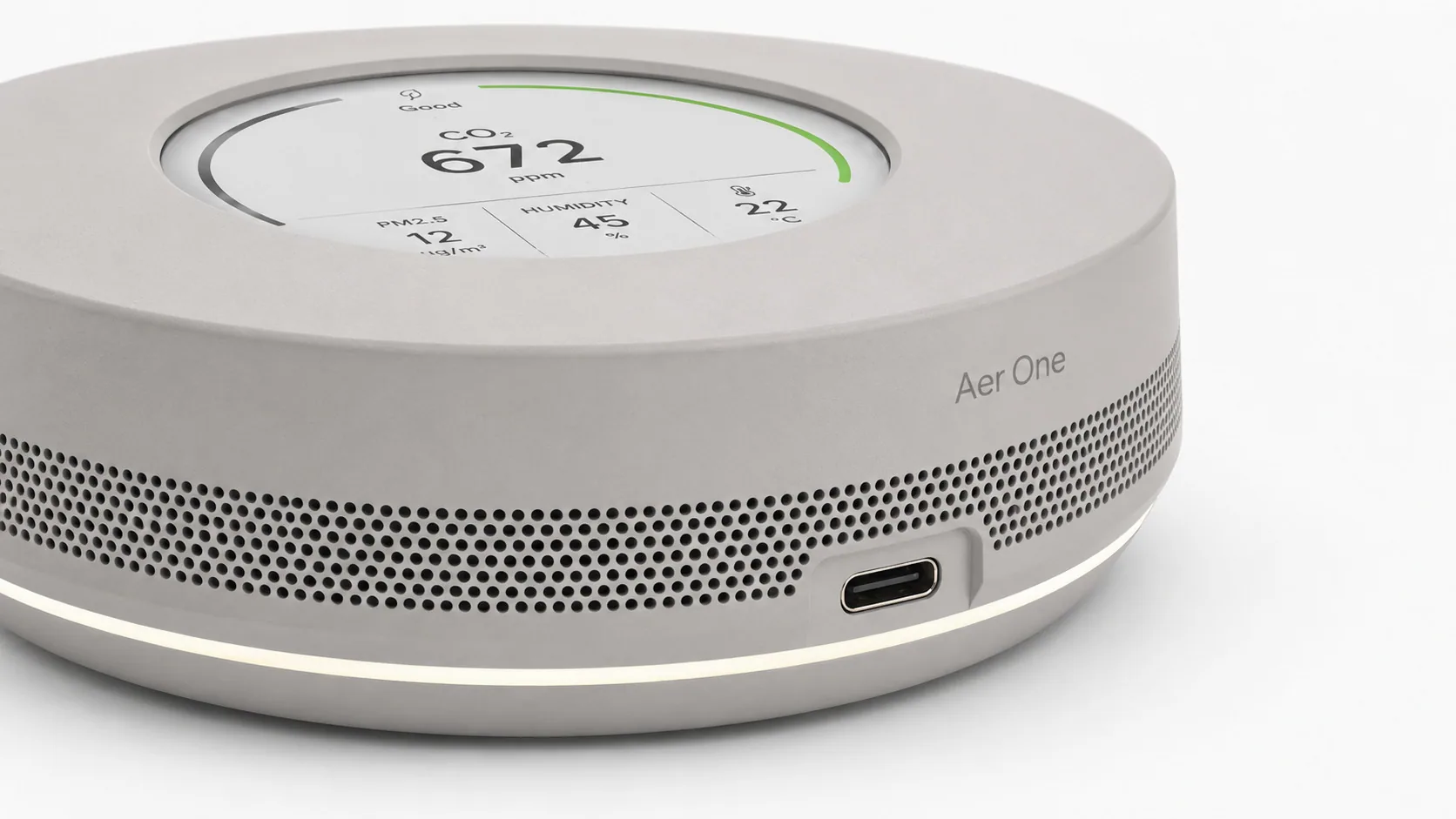 Aer One finished product — circular e-ink display, 360° intake band, USB-C interface and low-glare status ring.