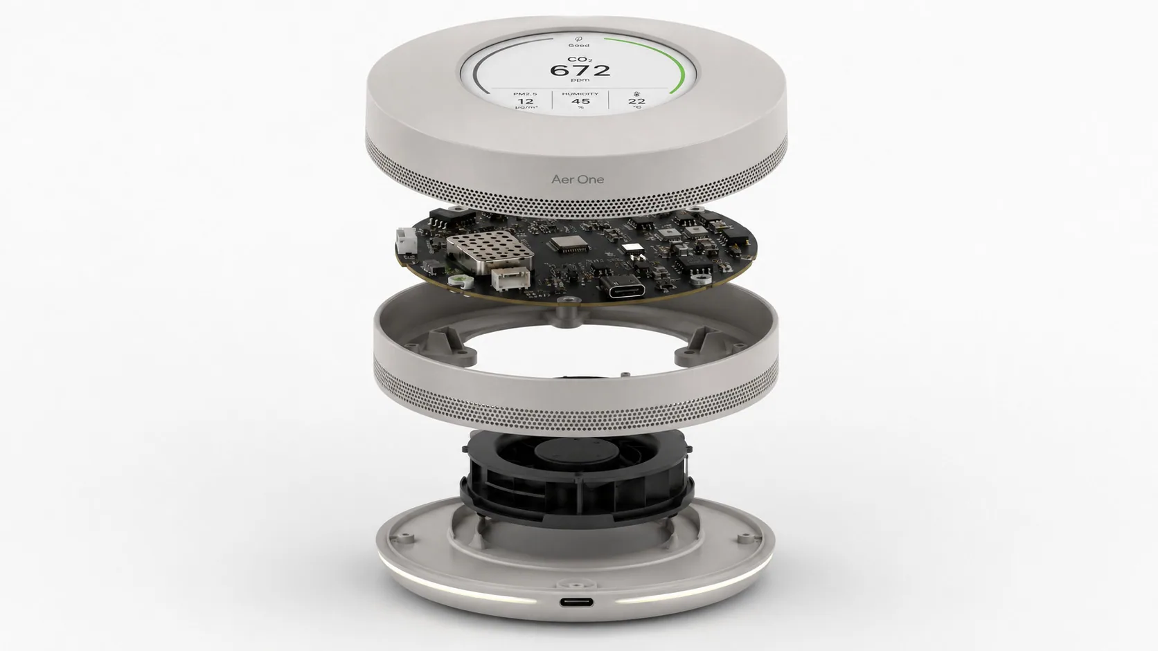Exploded product architecture — display shell, circular electronics assembly, sensing cavity, radial fan and illuminated base.