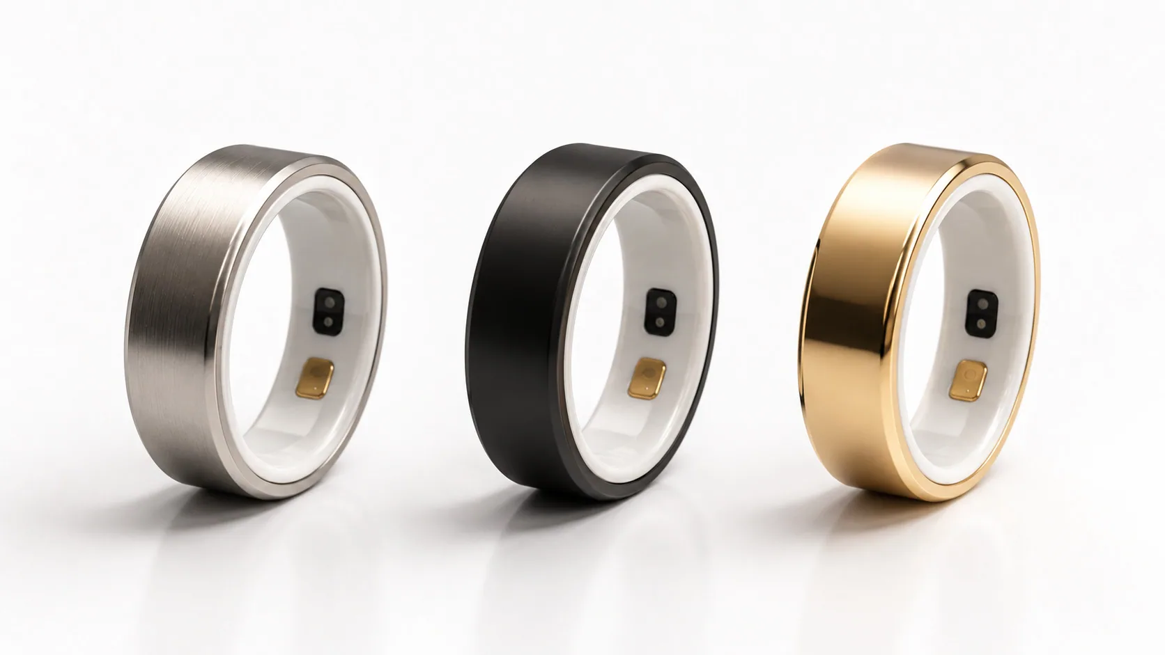 Orbi R1 smart ring in brushed titanium, black and gold finishes.